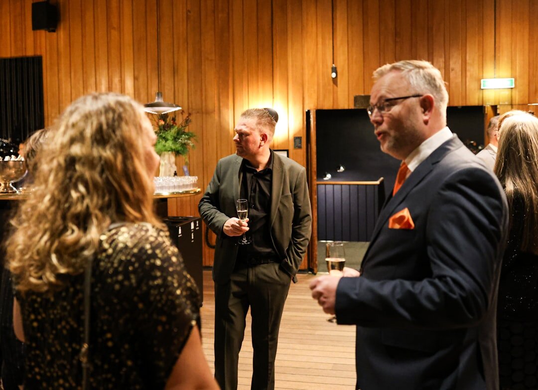 business people shaking hands at event